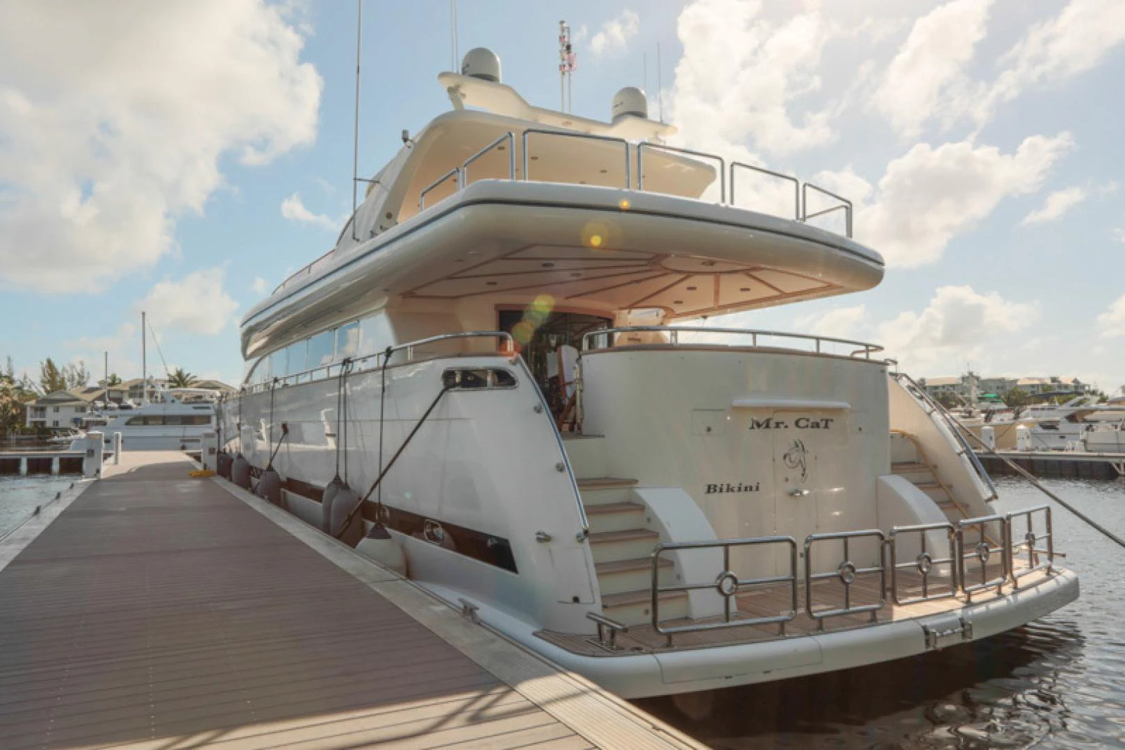 a large white boat docked aboard MR. CAT Yacht for Sale