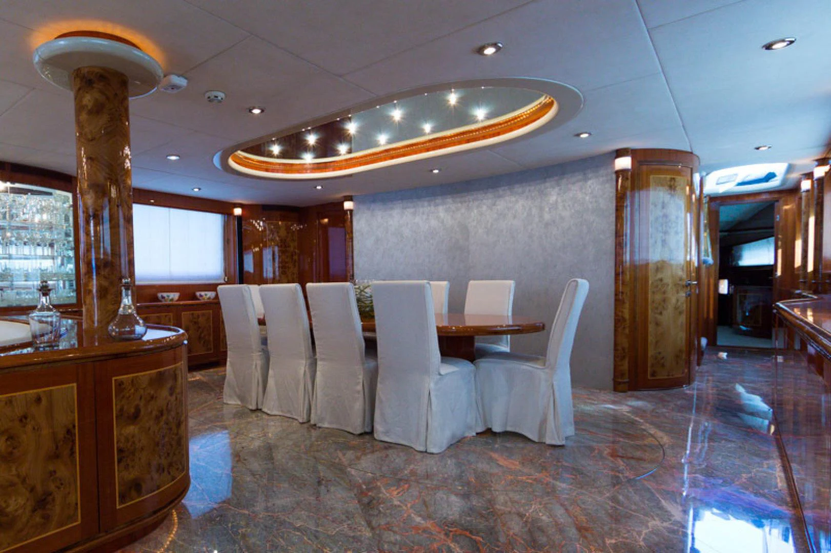 a room with a table and chairs aboard MR. CAT Yacht for Sale