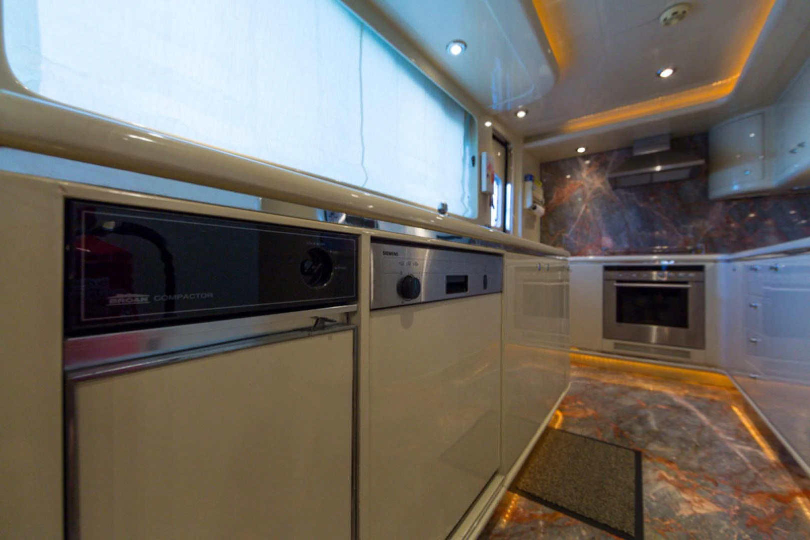 a kitchen with stainless steel appliances aboard MR. CAT Yacht for Sale