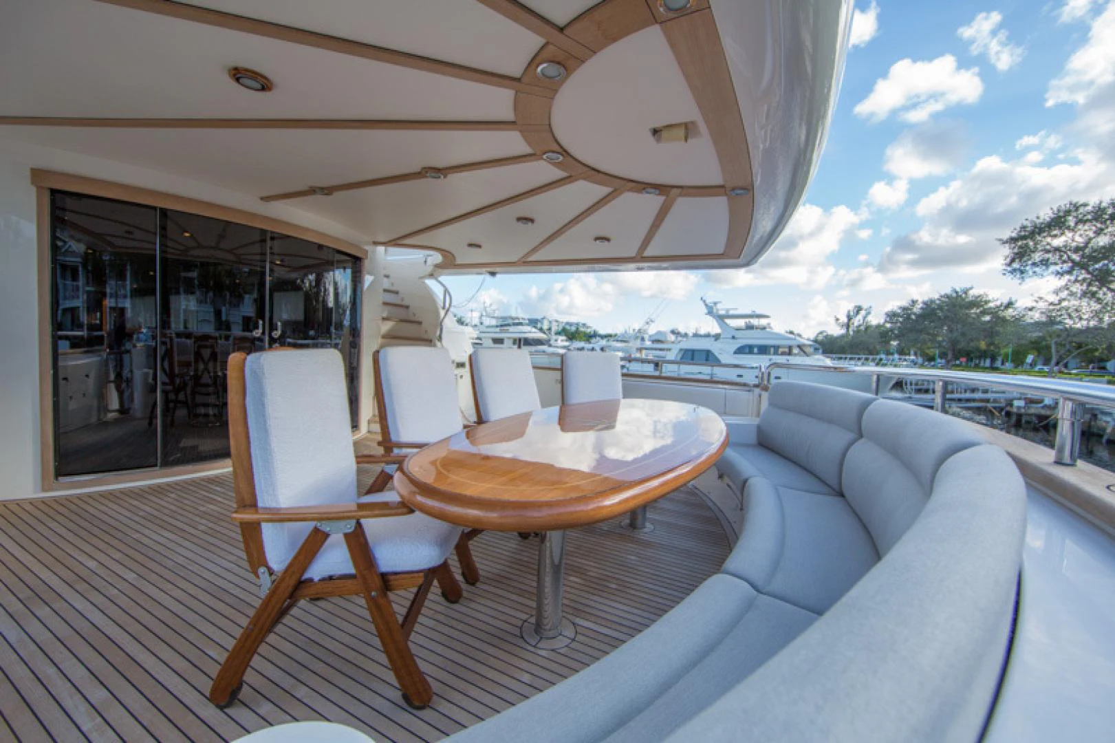 a table and chairs on a deck aboard MR. CAT Yacht for Sale