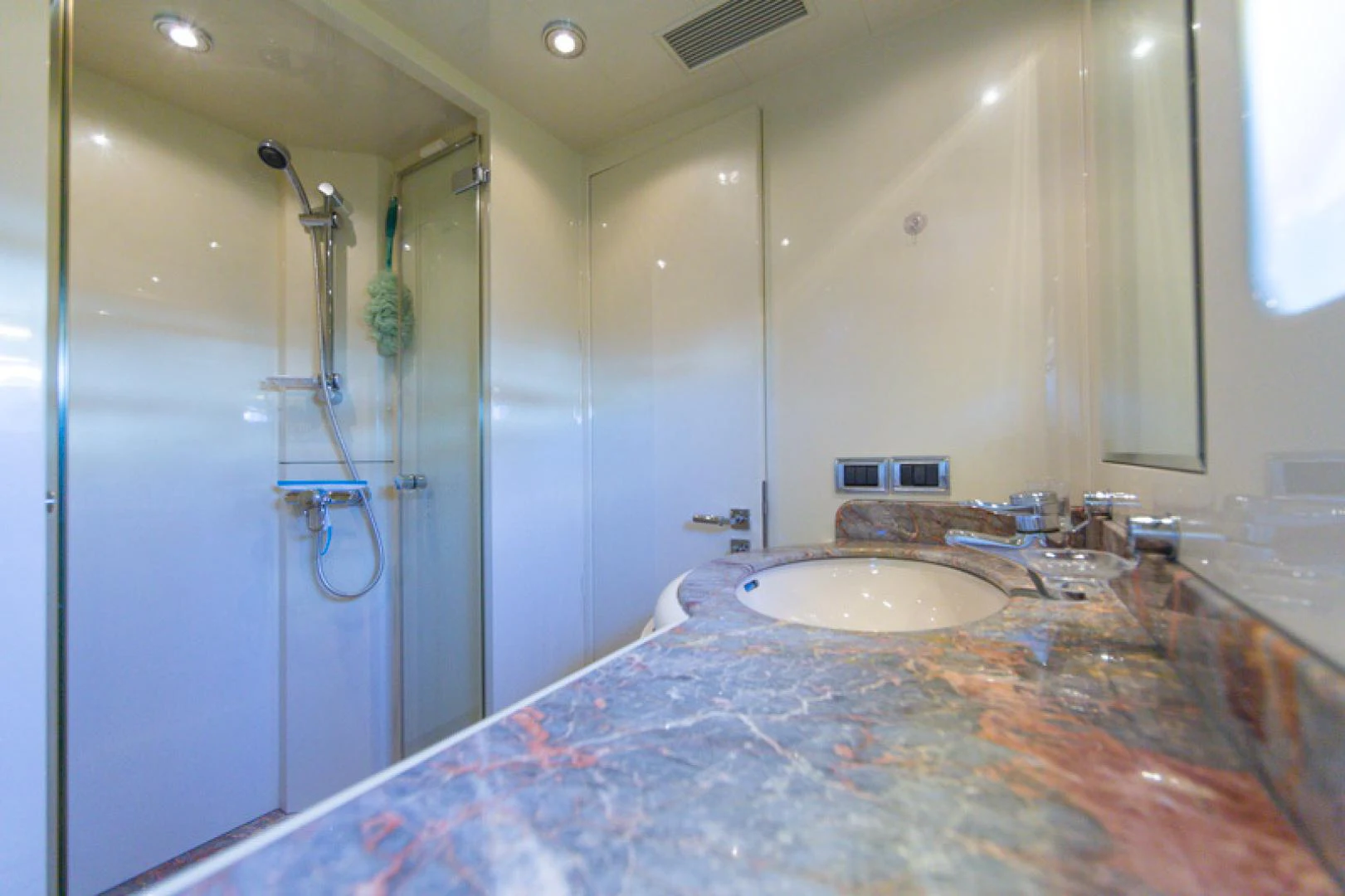 a bathroom with a large marble counter top aboard MR. CAT Yacht for Sale