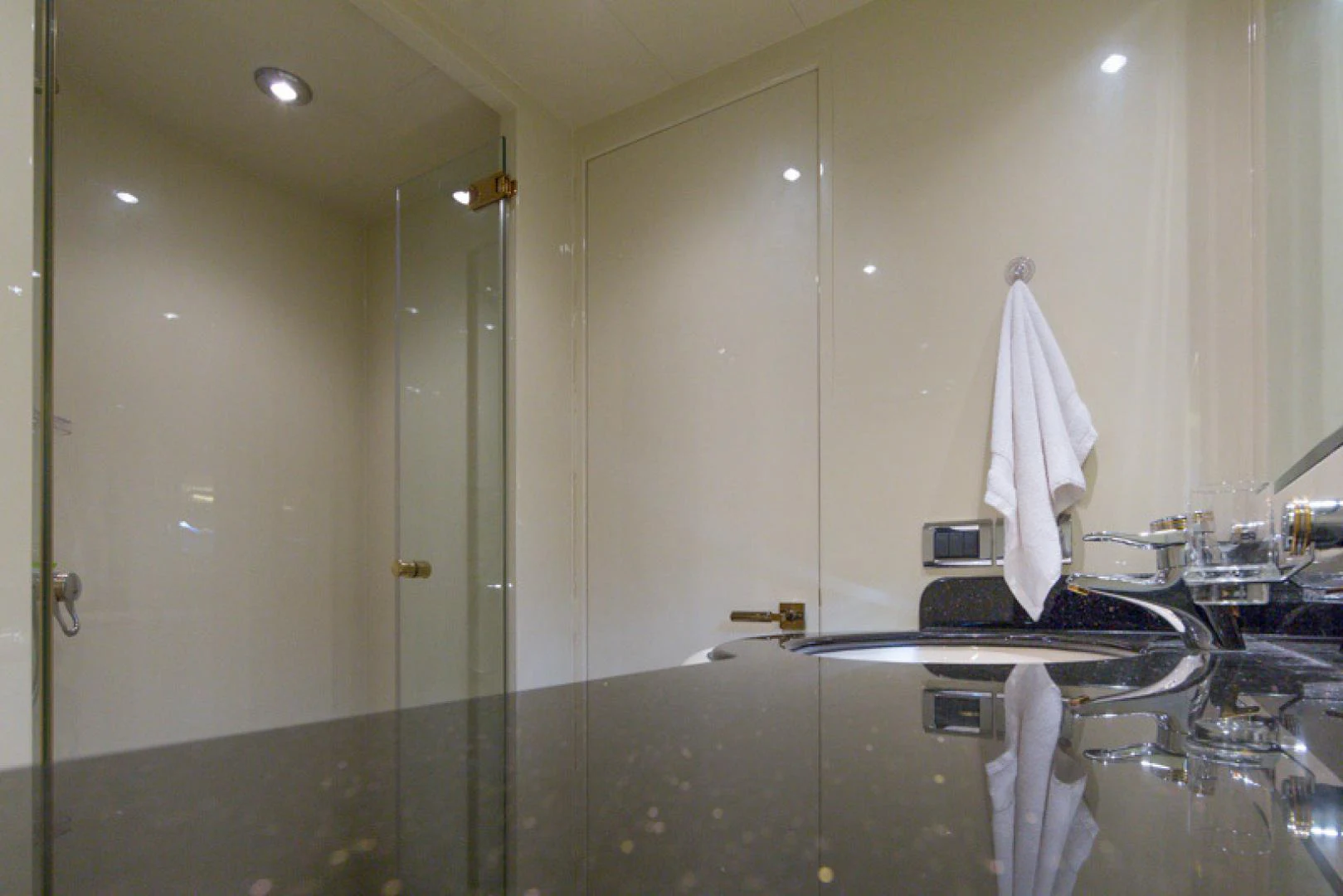 a bathroom with a glass shower aboard MR. CAT Yacht for Sale