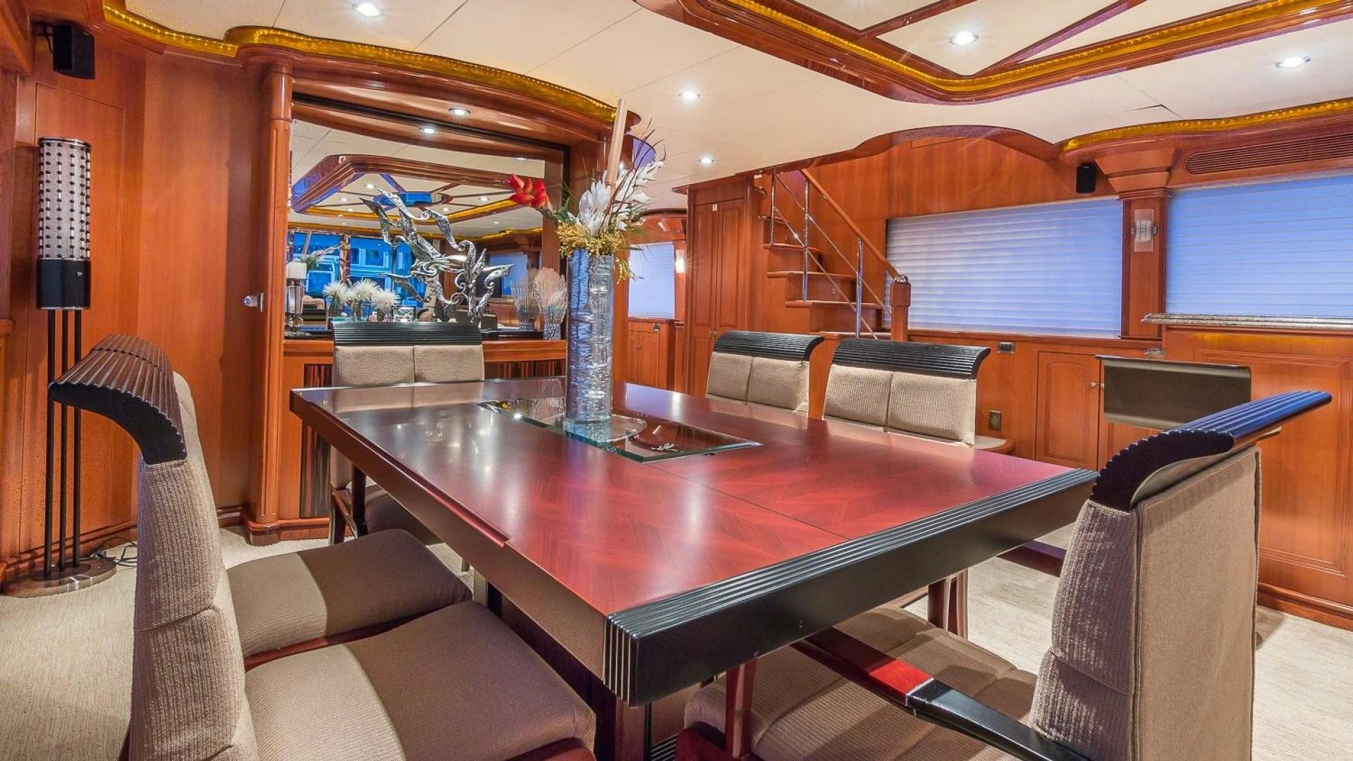 a large room with a table and chairs aboard D FENCE Yacht for Sale