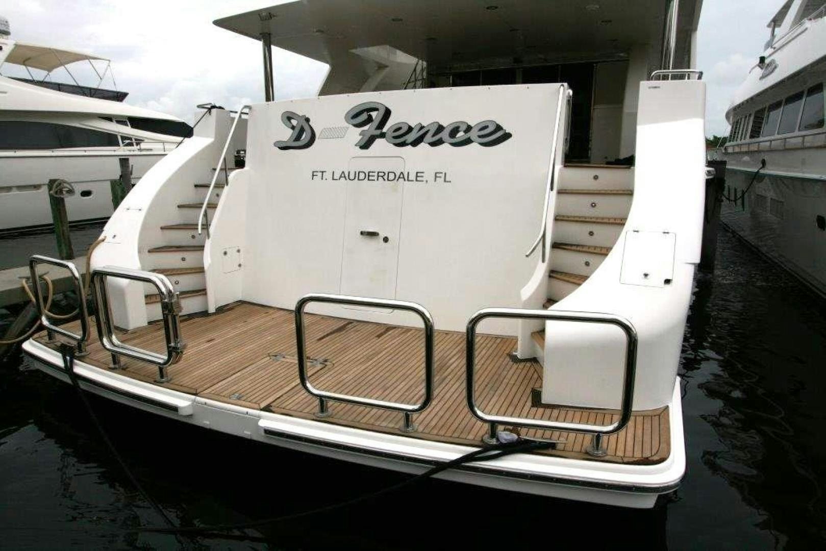 a boat with a sign on the front aboard D FENCE Yacht for Sale
