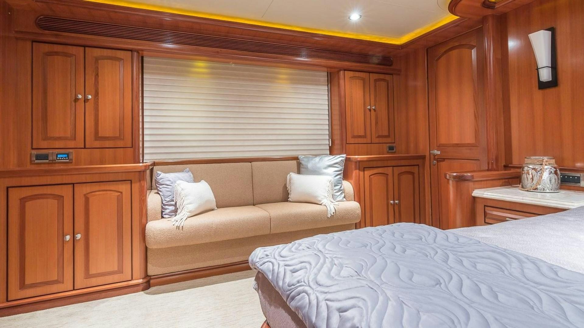 a room with a bed and a couch aboard D FENCE Yacht for Sale