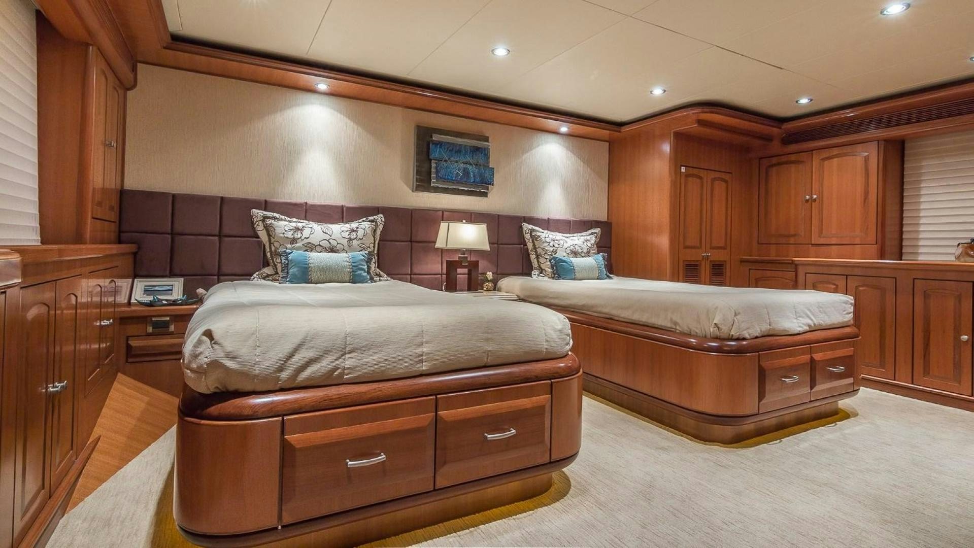a bedroom with a bed and a couch aboard D FENCE Yacht for Sale