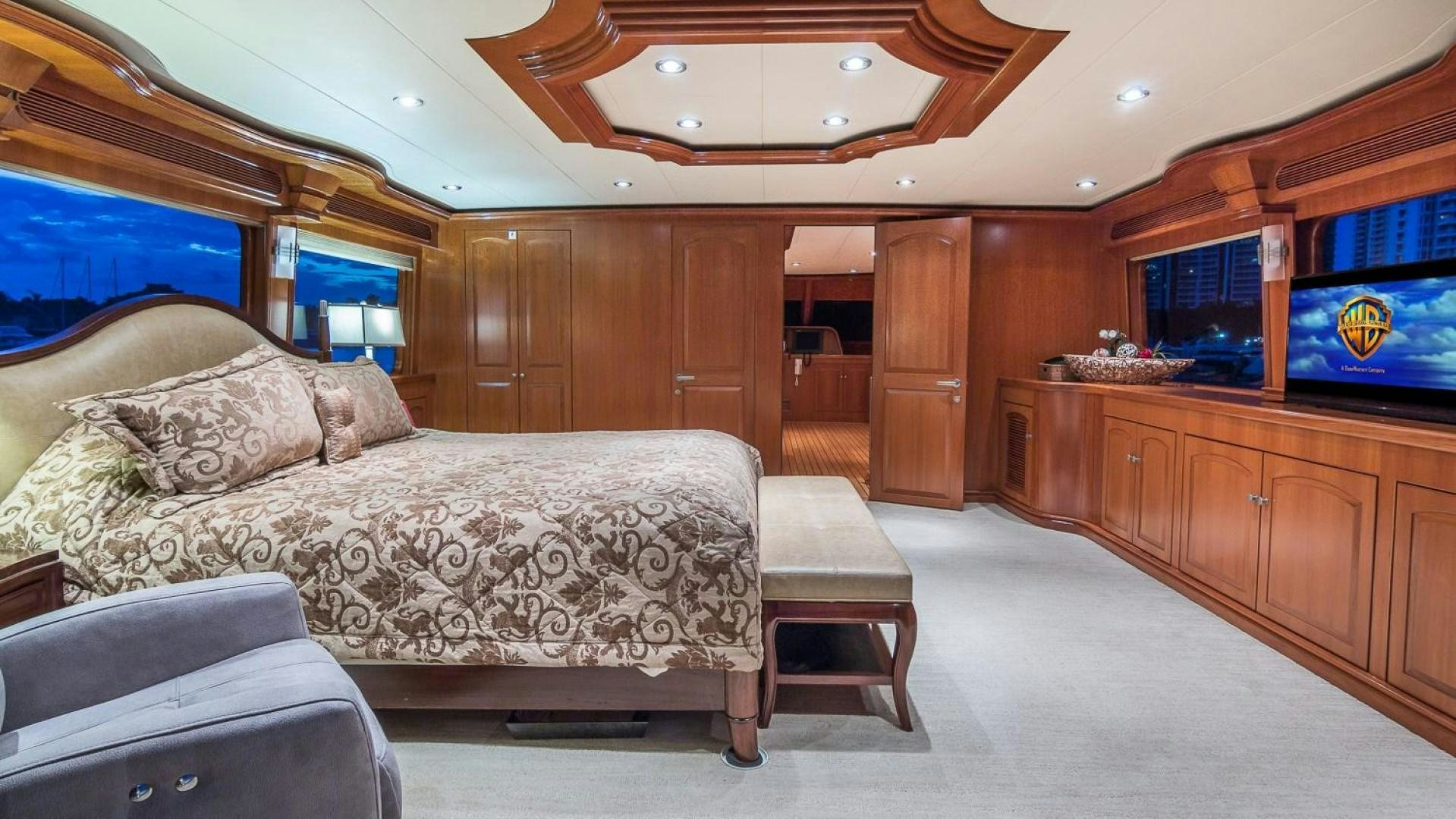 a bedroom with a bed and a chair aboard D FENCE Yacht for Sale