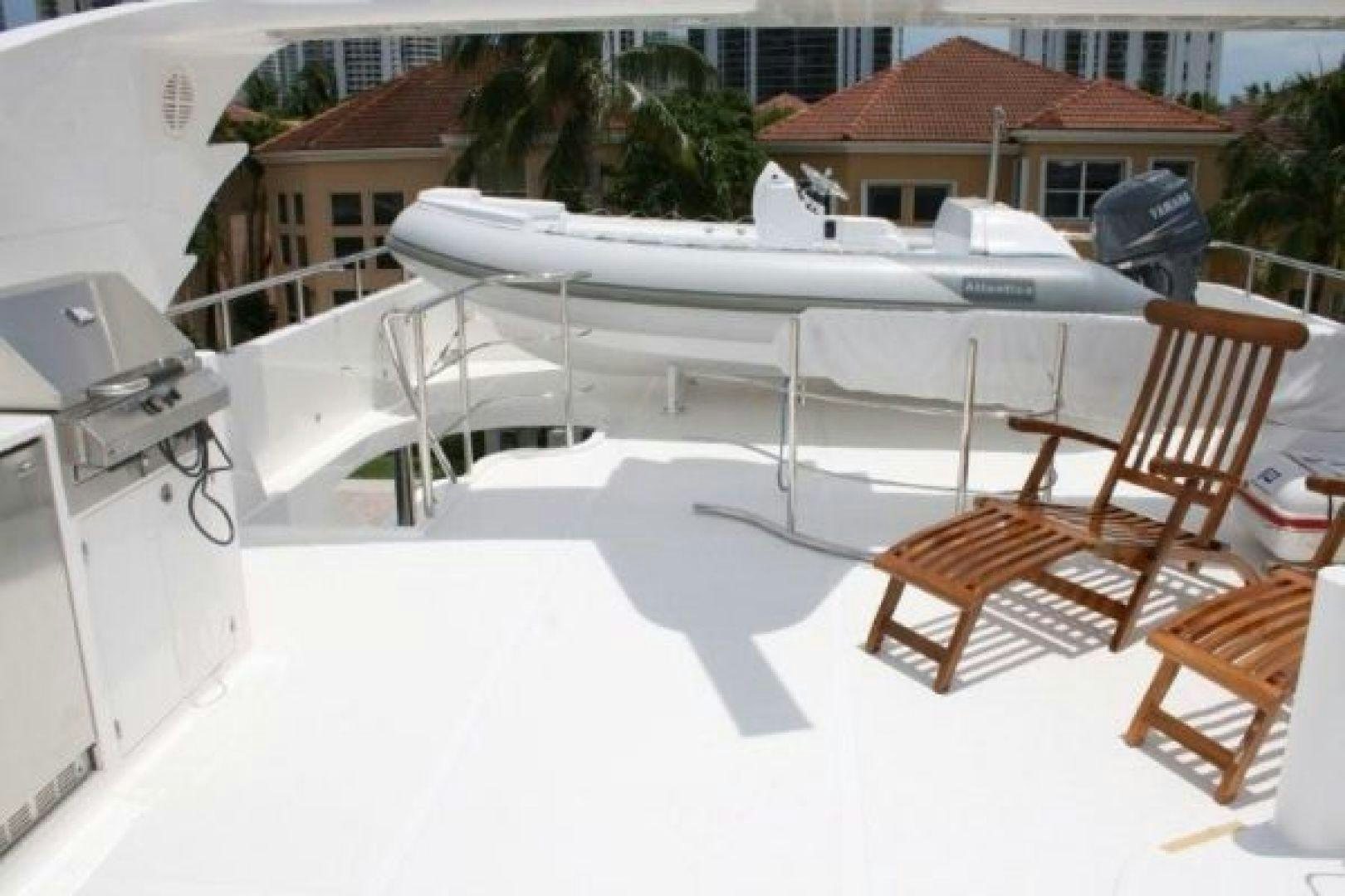 a white table with chairs and a white table on it aboard D FENCE Yacht for Sale