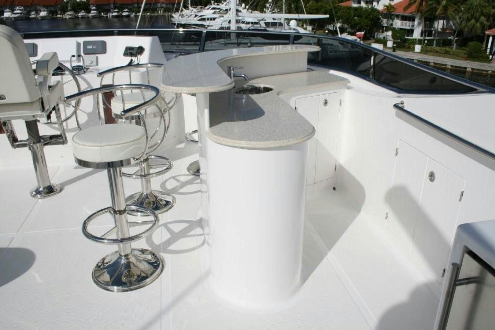 a table with chairs on it aboard D FENCE Yacht for Sale