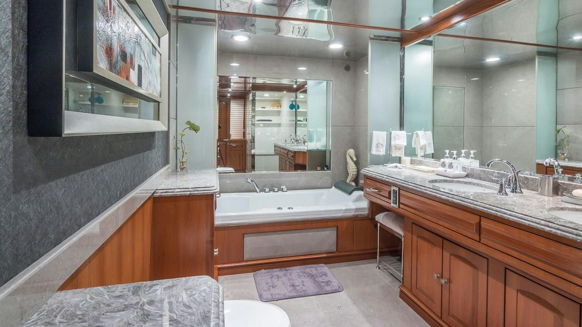 a bathroom with a large mirror aboard D FENCE Yacht for Sale