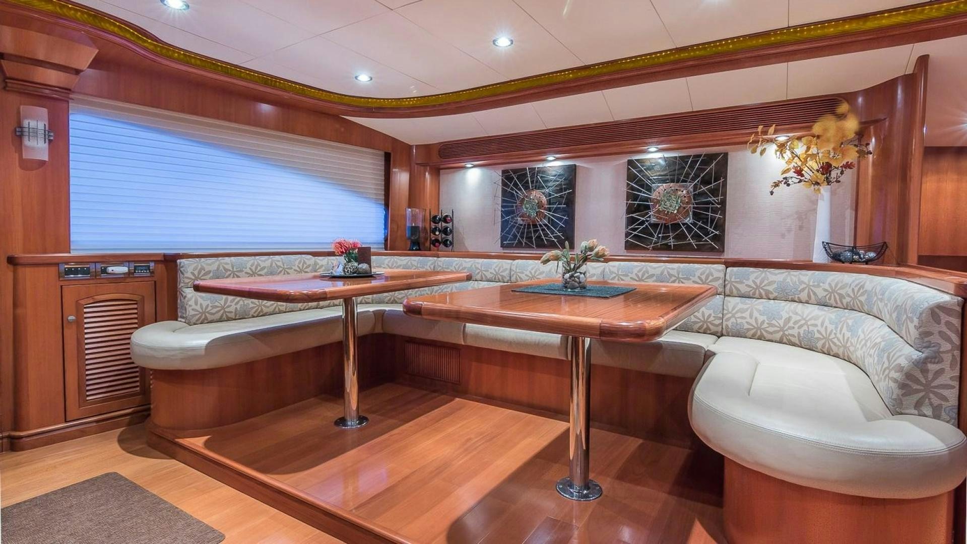 a large bathroom with a round table aboard D FENCE Yacht for Sale