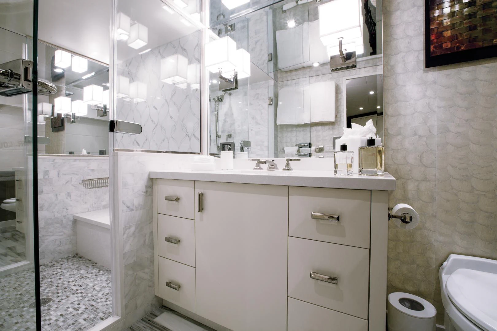 a bathroom with a glass shower aboard 2021 HATTERAS 105RPH Yacht for Sale