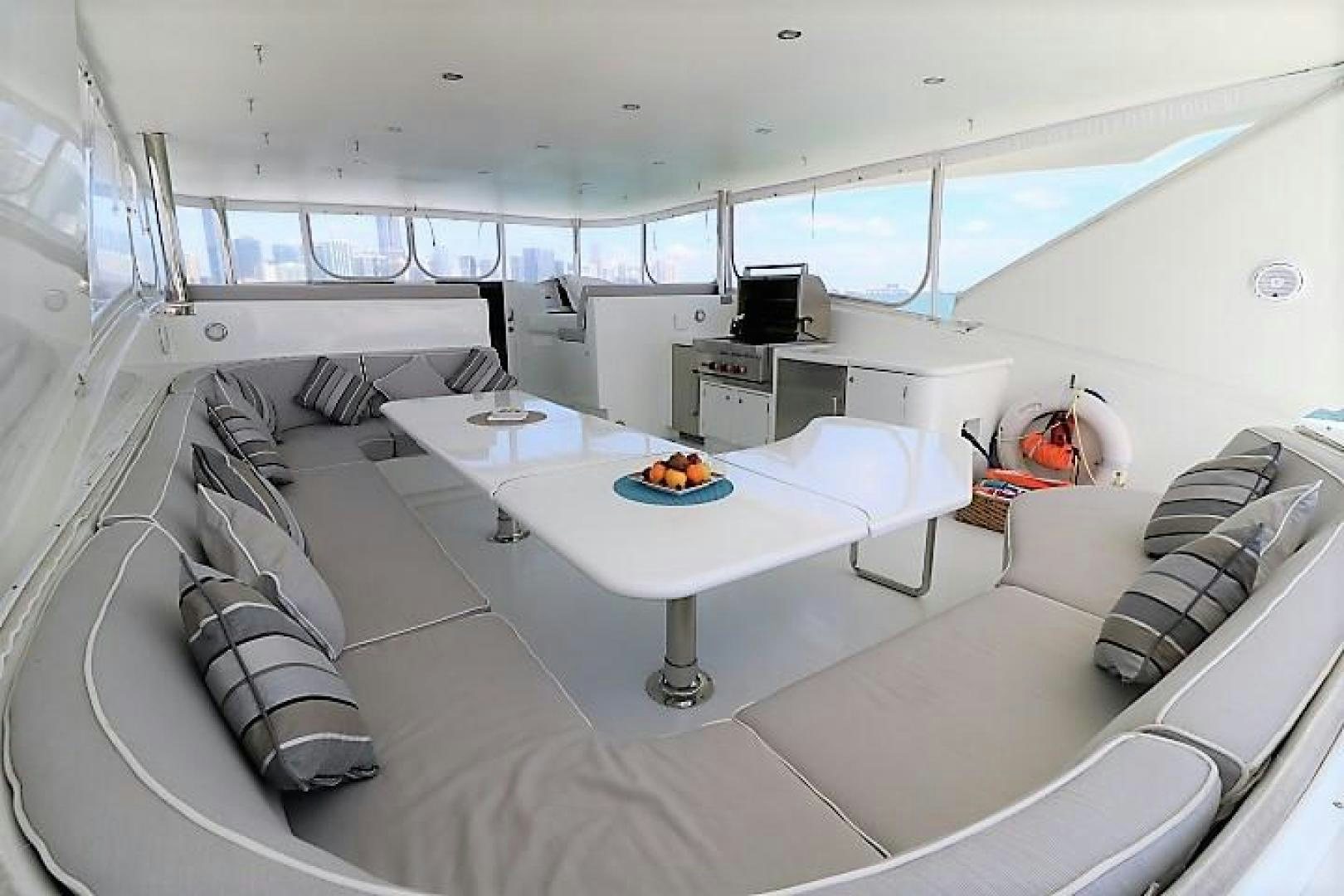 a room with a table and chairs aboard No Name Yacht for Sale