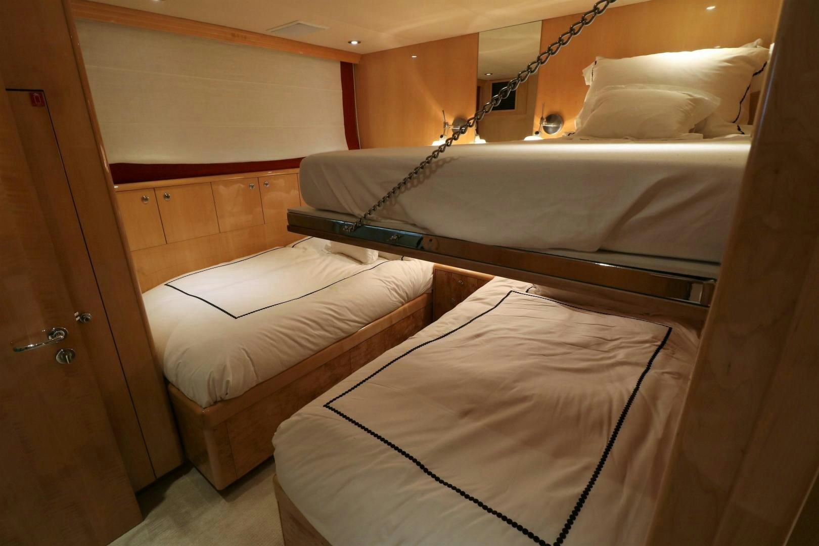 a couple of beds in a room aboard No Name Yacht for Sale