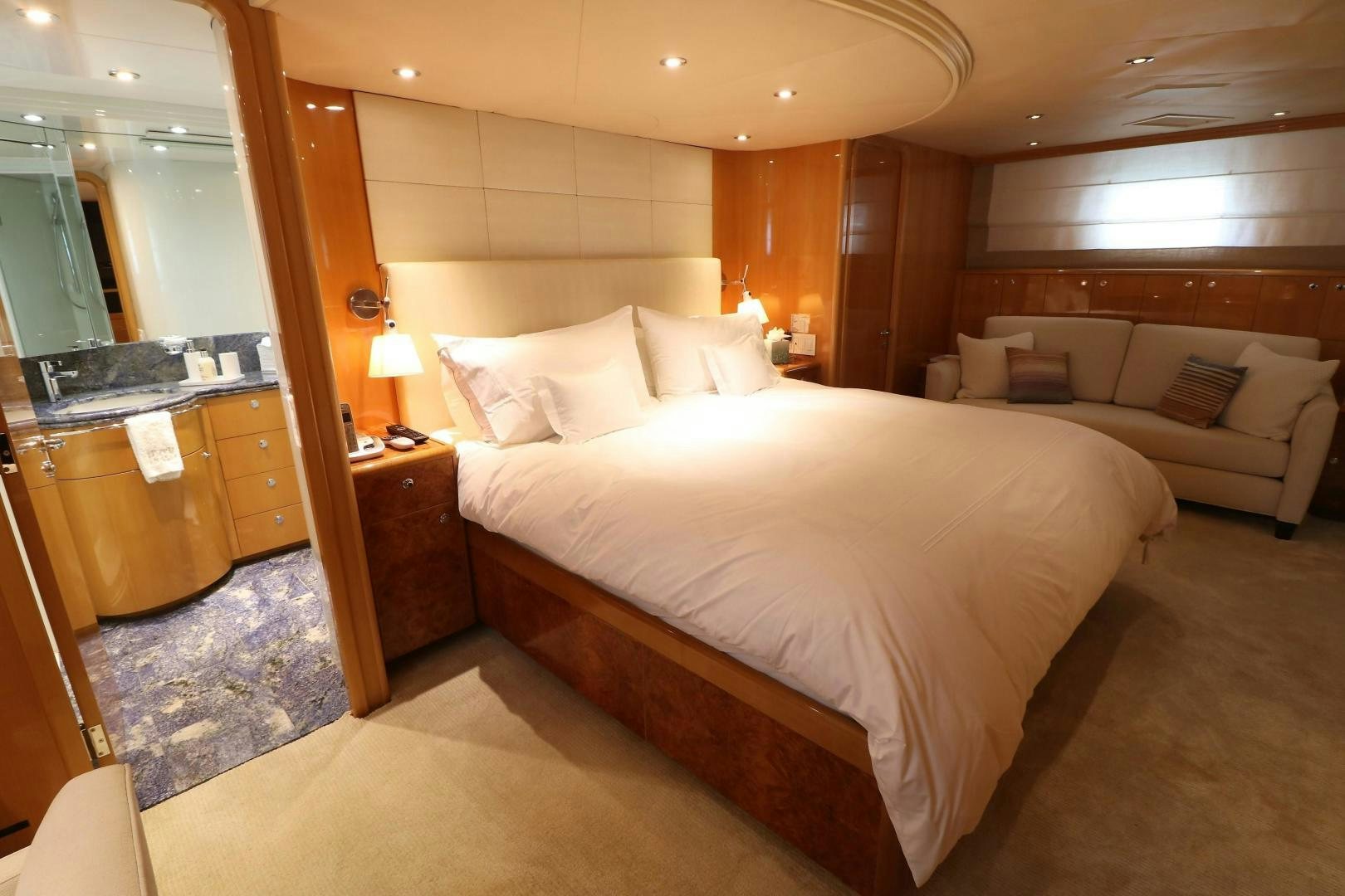 a hotel room with a bed and a couch aboard No Name Yacht for Sale