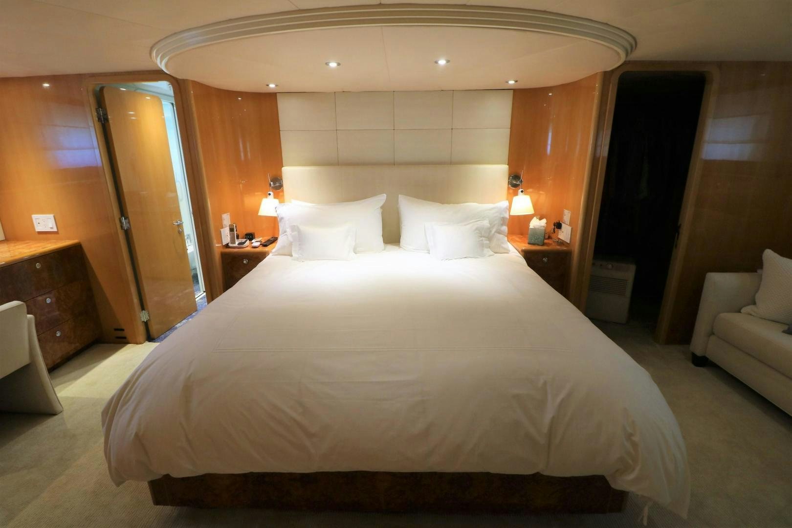 a bed with white sheets aboard No Name Yacht for Sale
