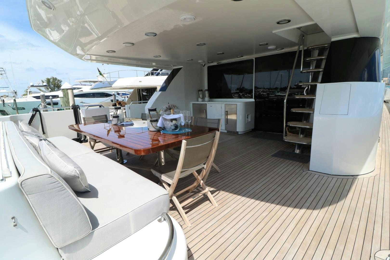 a large room with a table and chairs aboard No Name Yacht for Sale