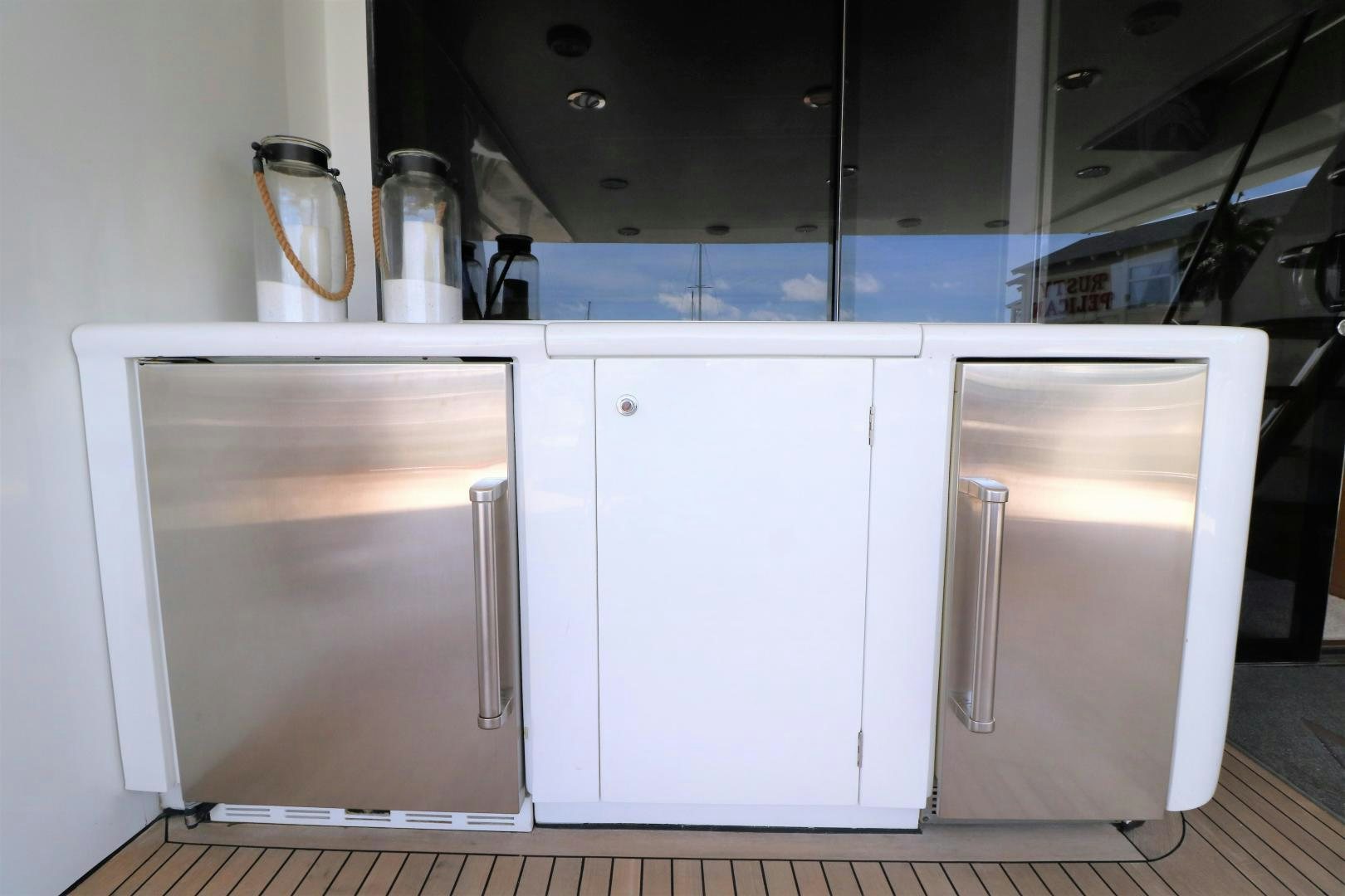 a kitchen with white cabinets aboard No Name Yacht for Sale