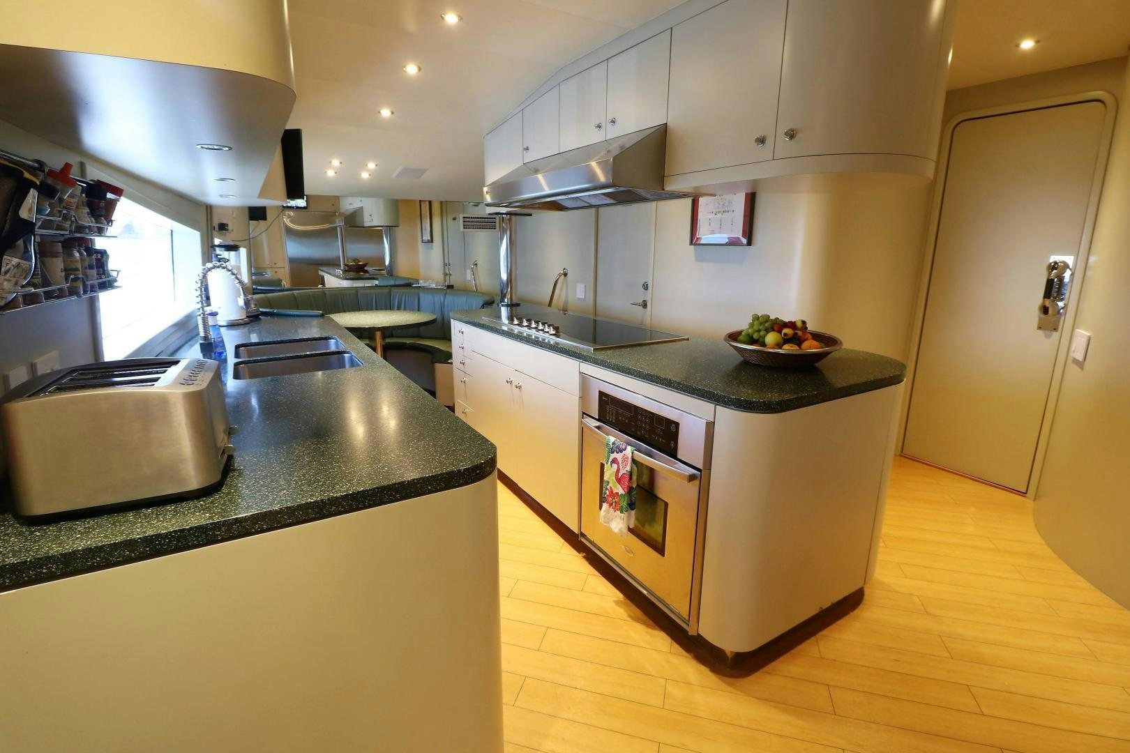 a kitchen with a large island aboard No Name Yacht for Sale
