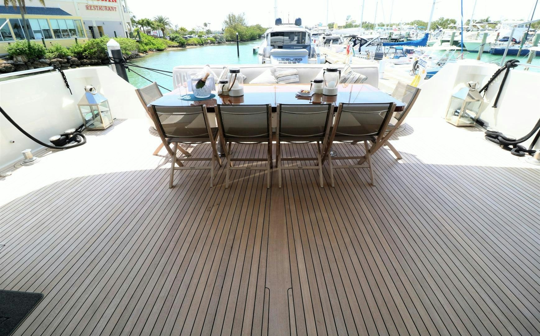 a table and chairs on a deck aboard No Name Yacht for Sale