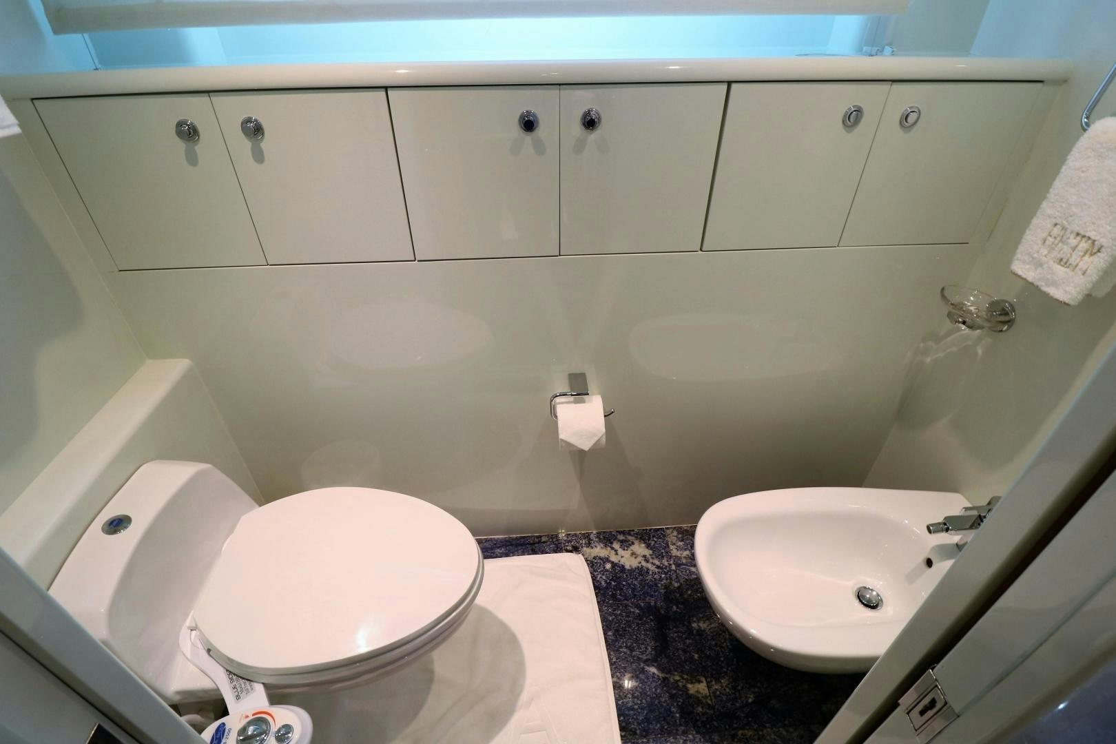 a bathroom with a sink and toilet aboard No Name Yacht for Sale