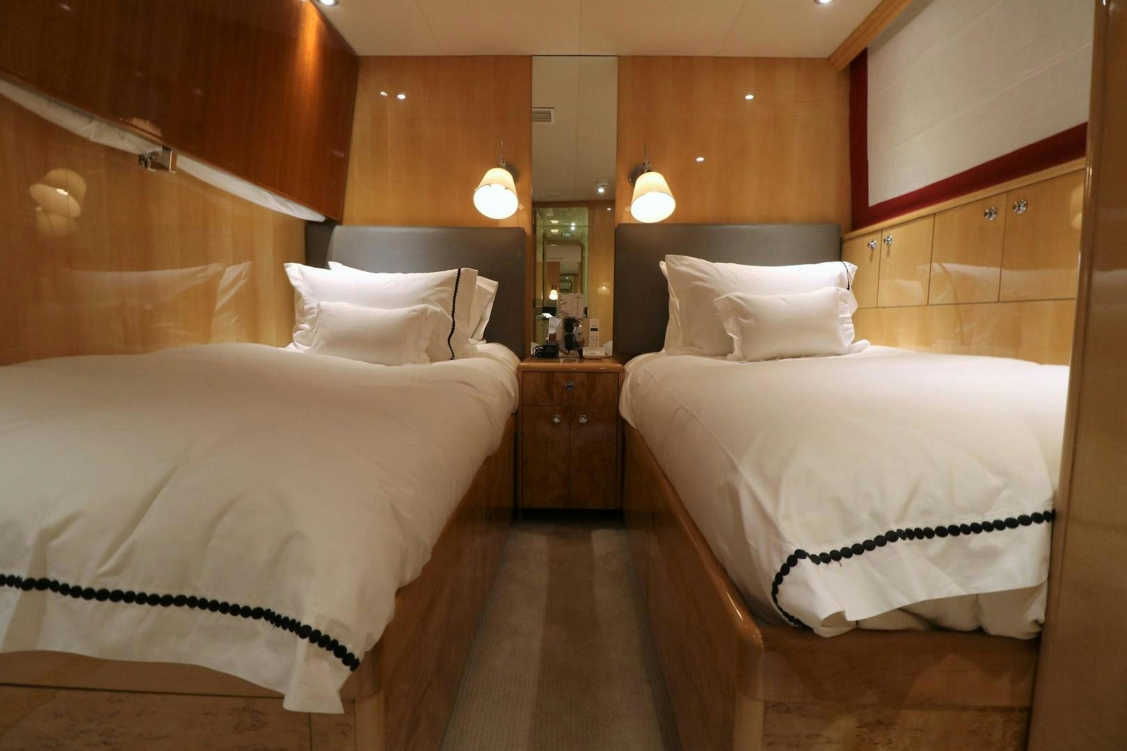a couple of beds in a room aboard No Name Yacht for Sale