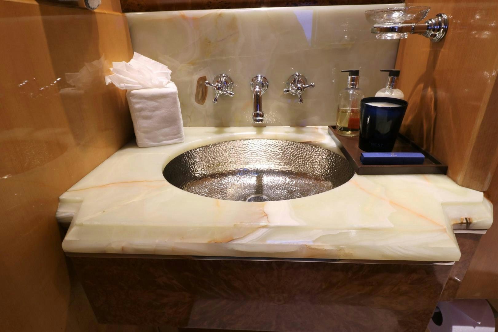 a bathroom sink with a mirror aboard No Name Yacht for Sale