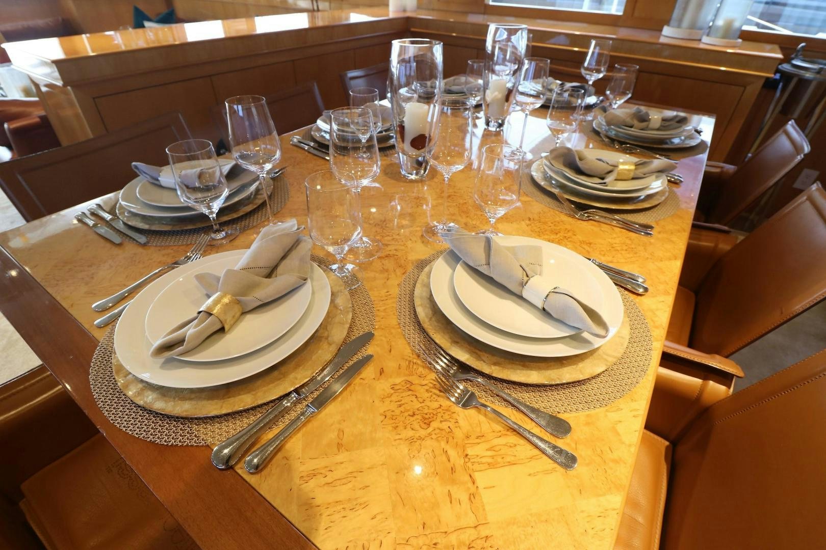 a table with plates and silverware aboard No Name Yacht for Sale