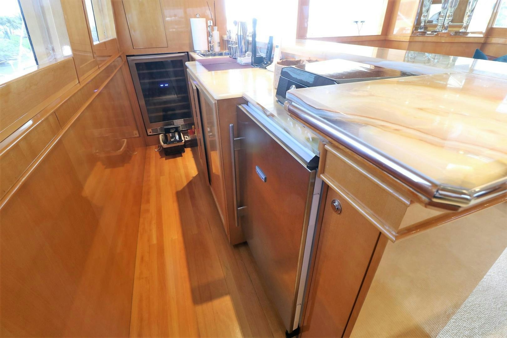 a kitchen with a large island aboard No Name Yacht for Sale