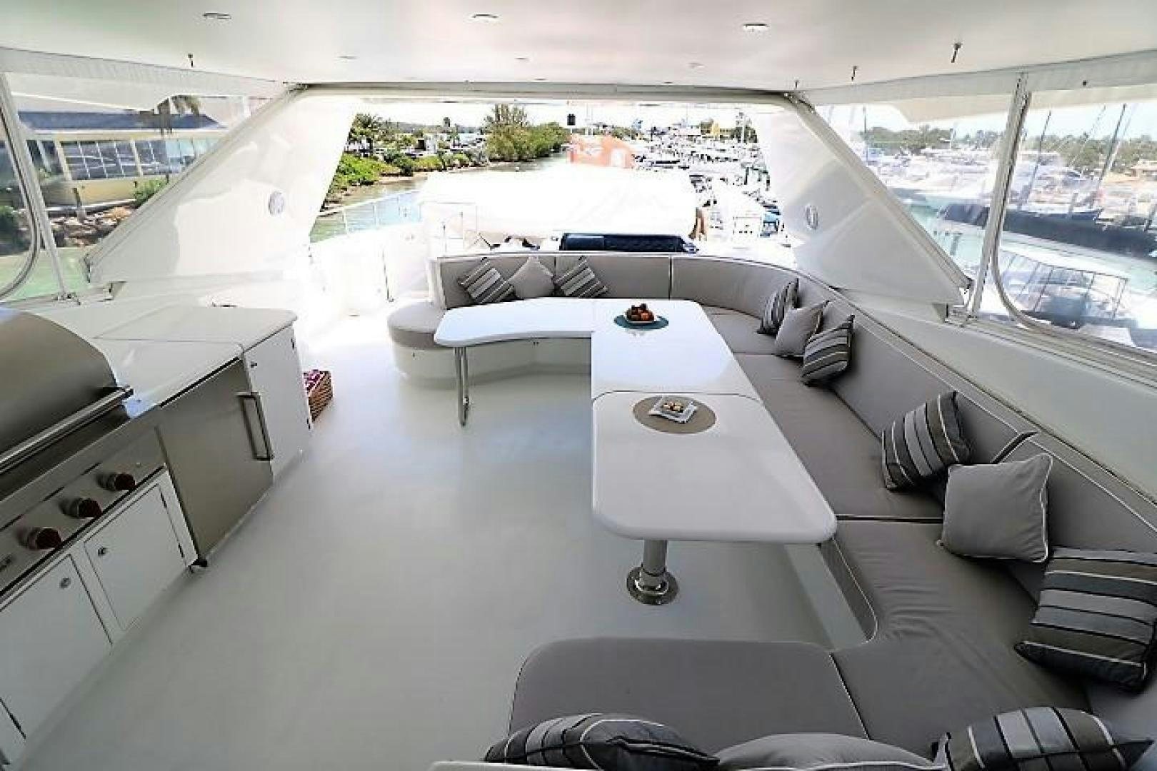 a room with a large window and a view of the city aboard No Name Yacht for Sale