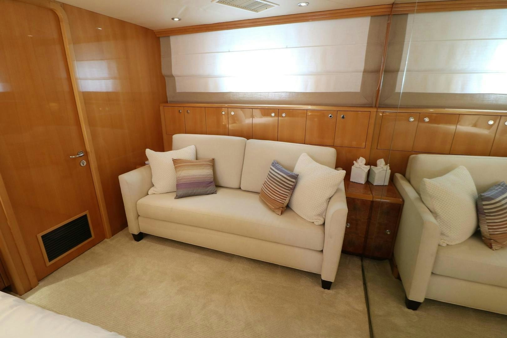 a room with a couch and a table aboard No Name Yacht for Sale