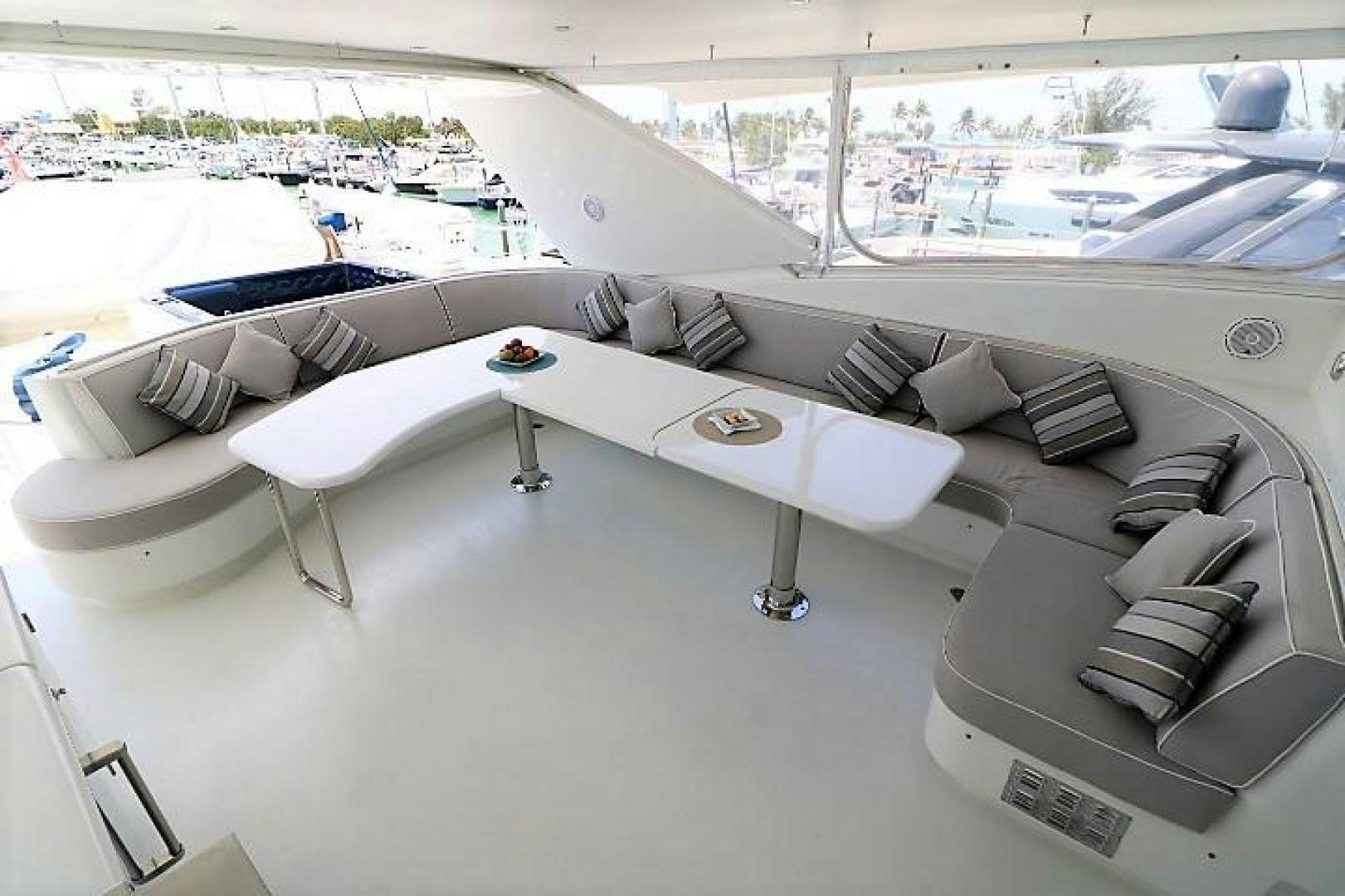 a room with a couch and a table aboard No Name Yacht for Sale