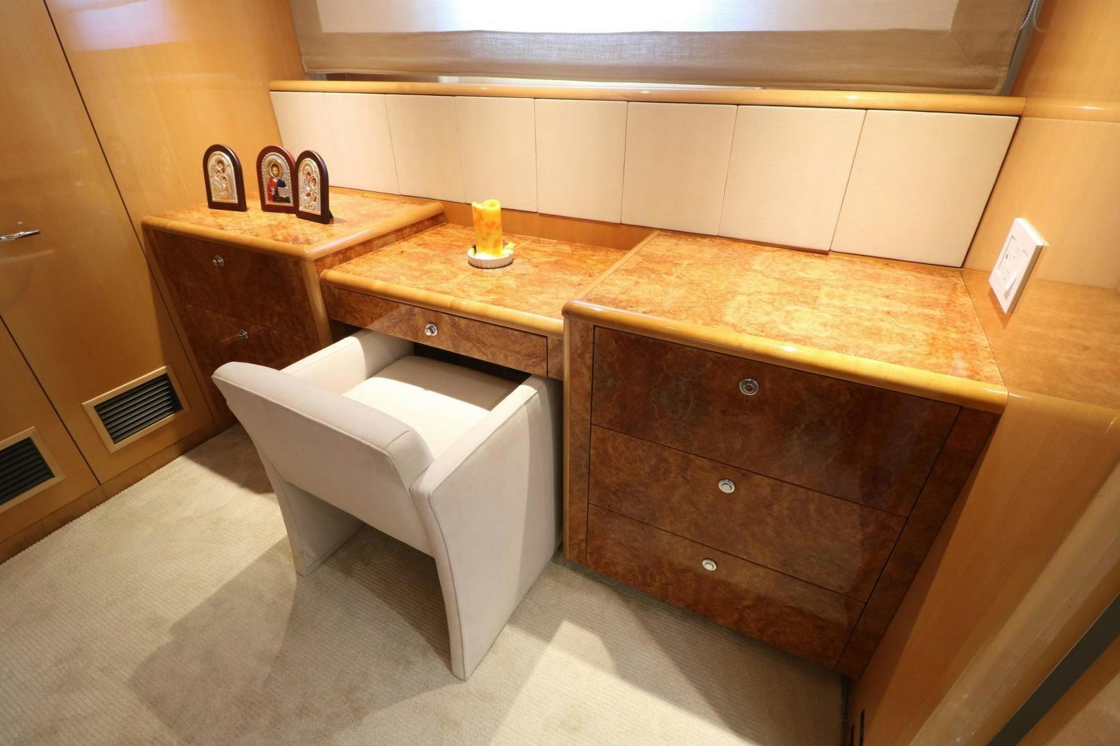 a white chair in a room aboard No Name Yacht for Sale