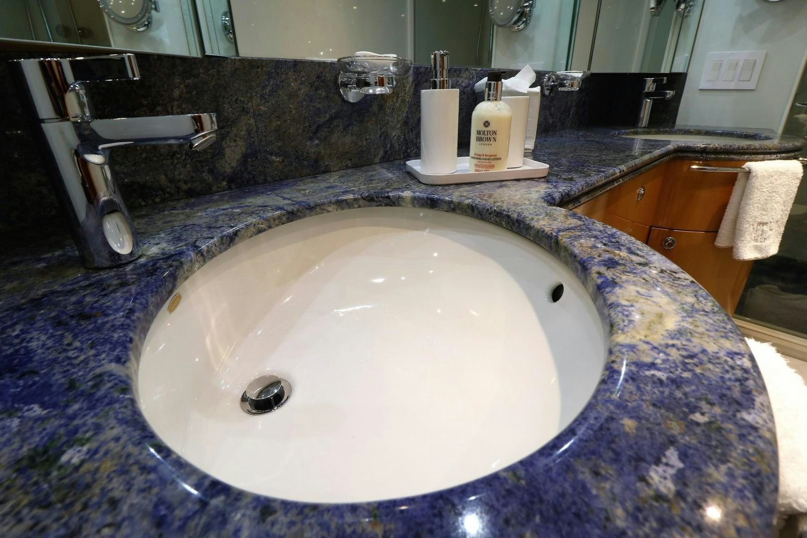 a bathroom sink with a mirror aboard No Name Yacht for Sale