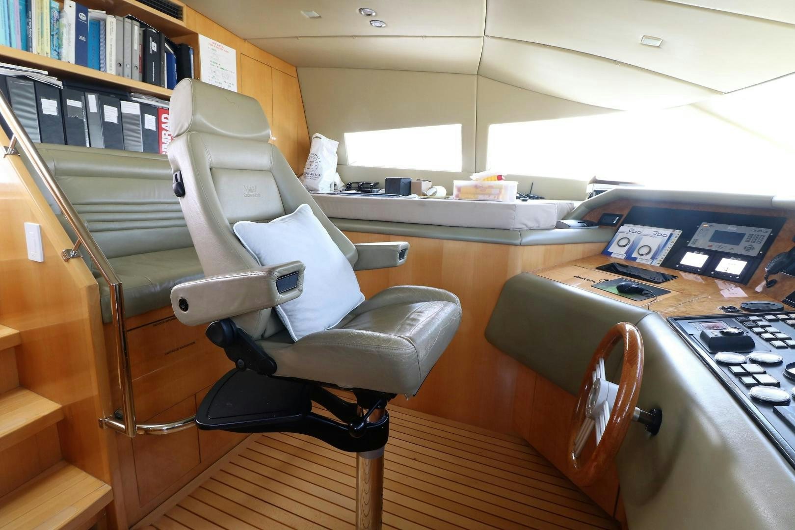 a chair in a library aboard No Name Yacht for Sale