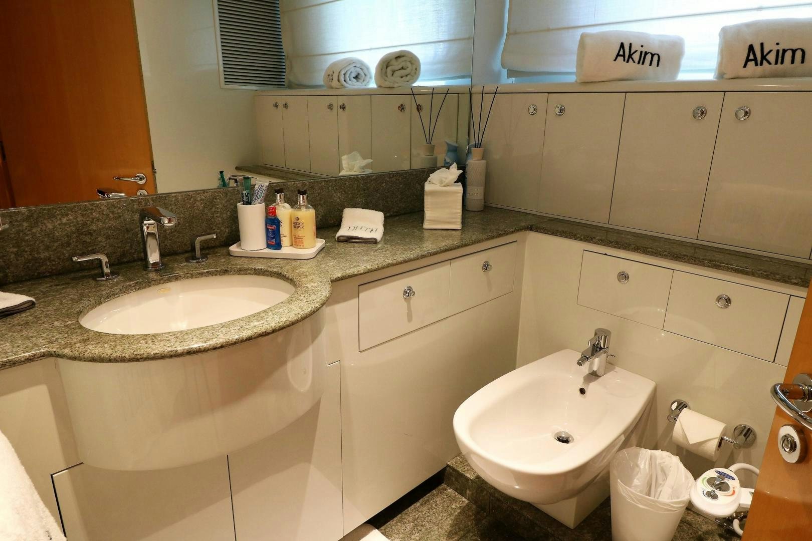 a bathroom with a sink and a mirror aboard No Name Yacht for Sale