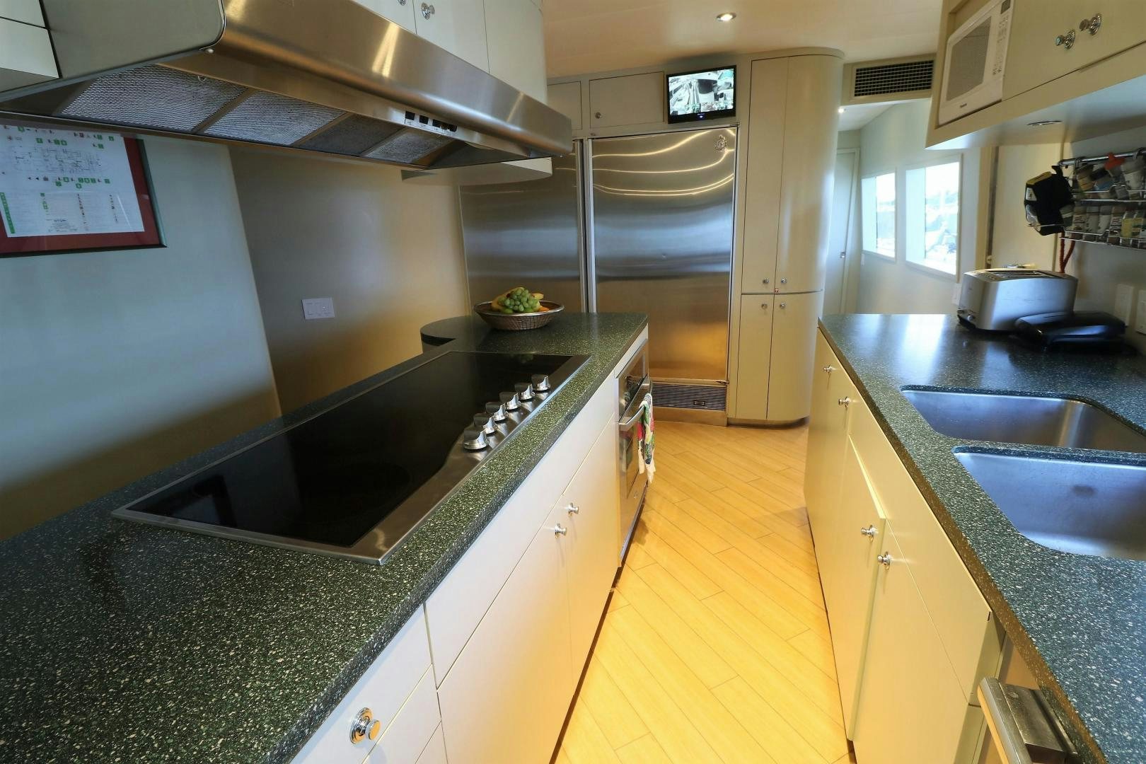 a kitchen with a large island aboard No Name Yacht for Sale