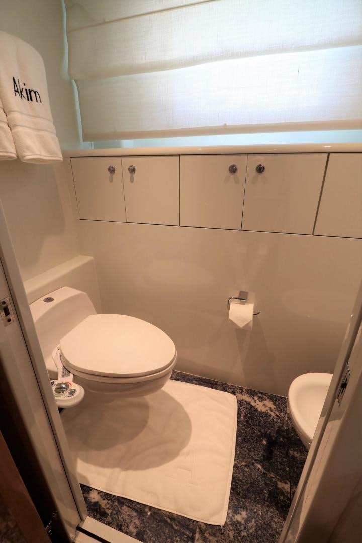 a bathroom with white cabinets aboard No Name Yacht for Sale
