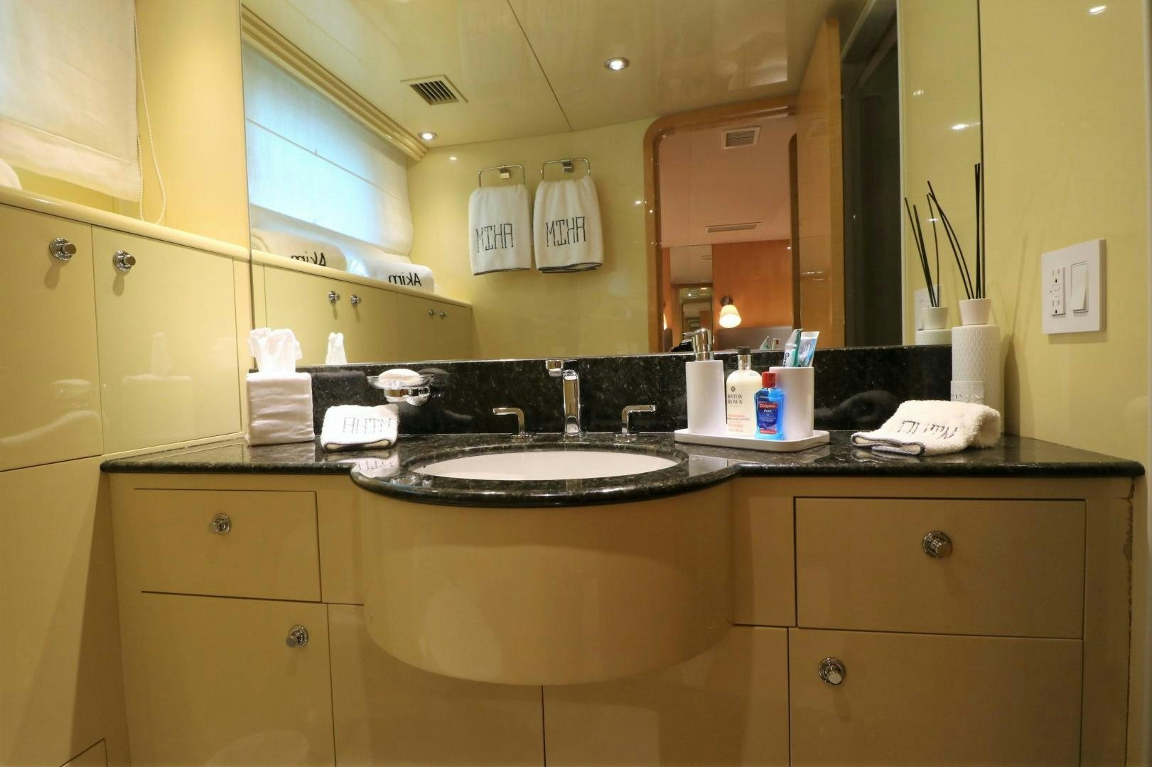 a bathroom with a sink and cabinets aboard No Name Yacht for Sale
