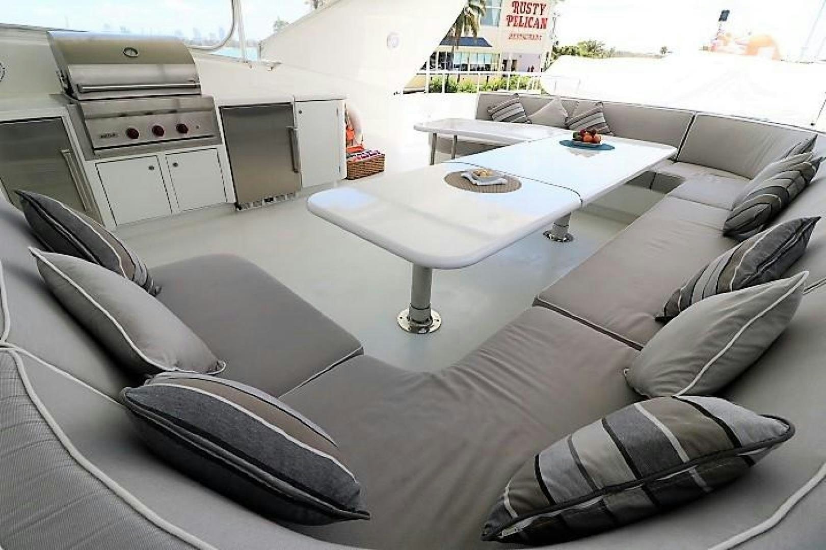a room with a couch and a table aboard No Name Yacht for Sale