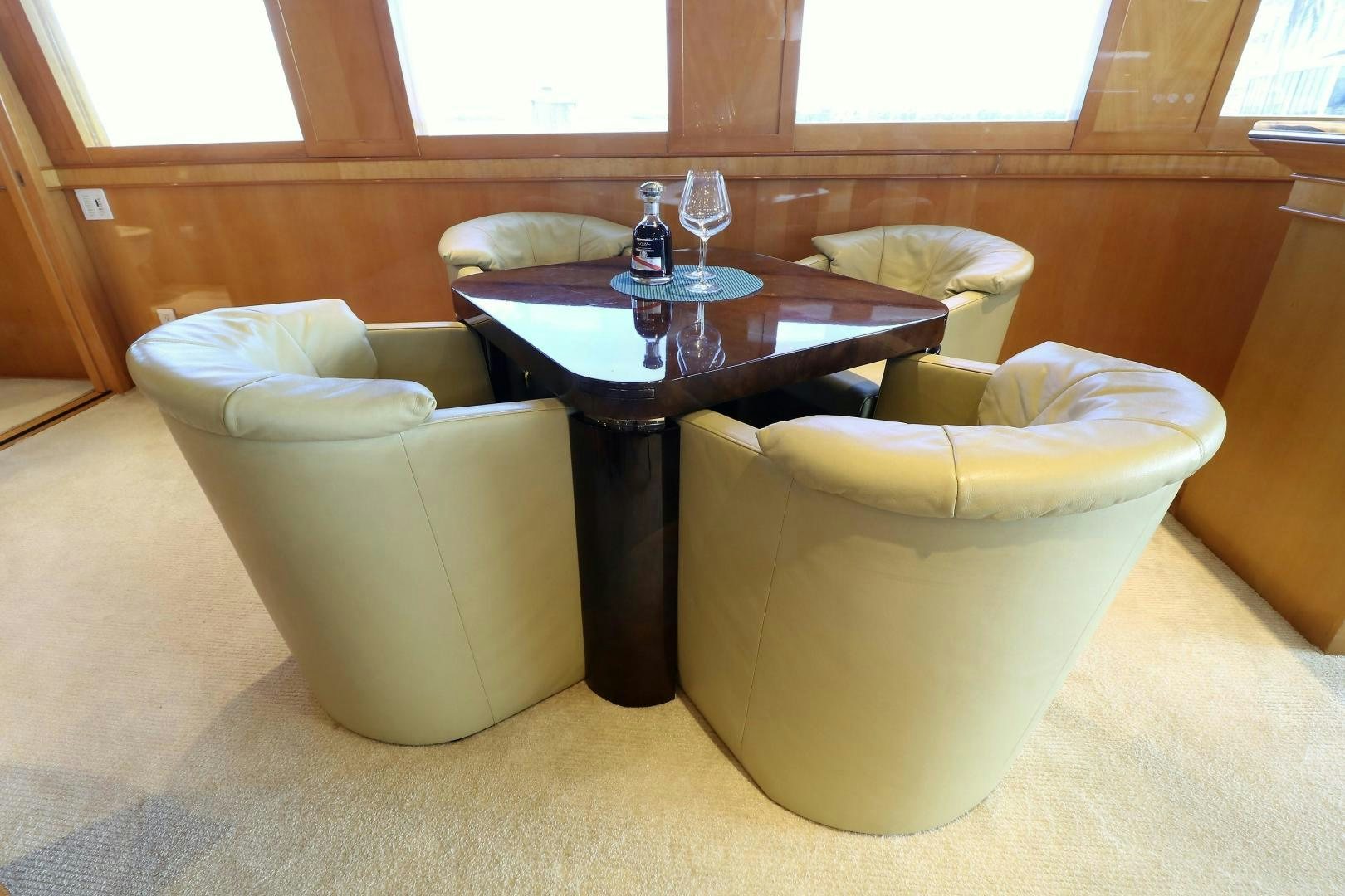 a room with a table and chairs aboard No Name Yacht for Sale