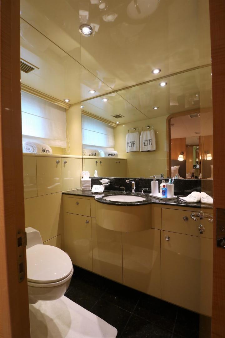 a bathroom with a large mirror aboard No Name Yacht for Sale