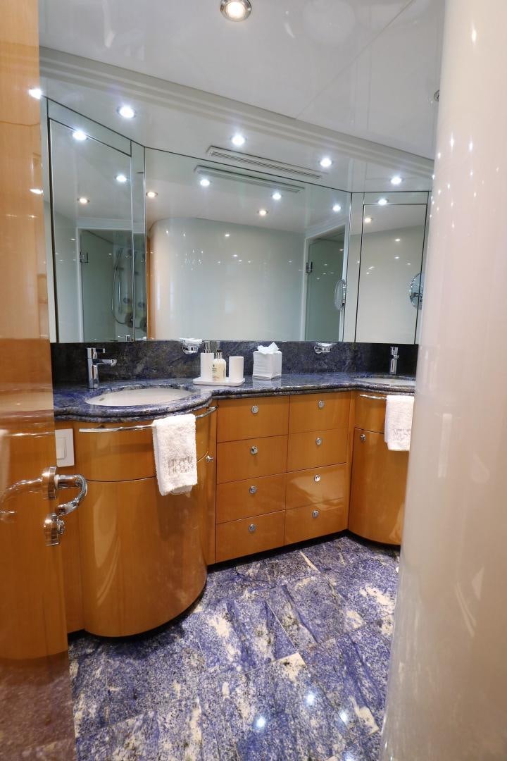a bathroom with a large mirror aboard No Name Yacht for Sale