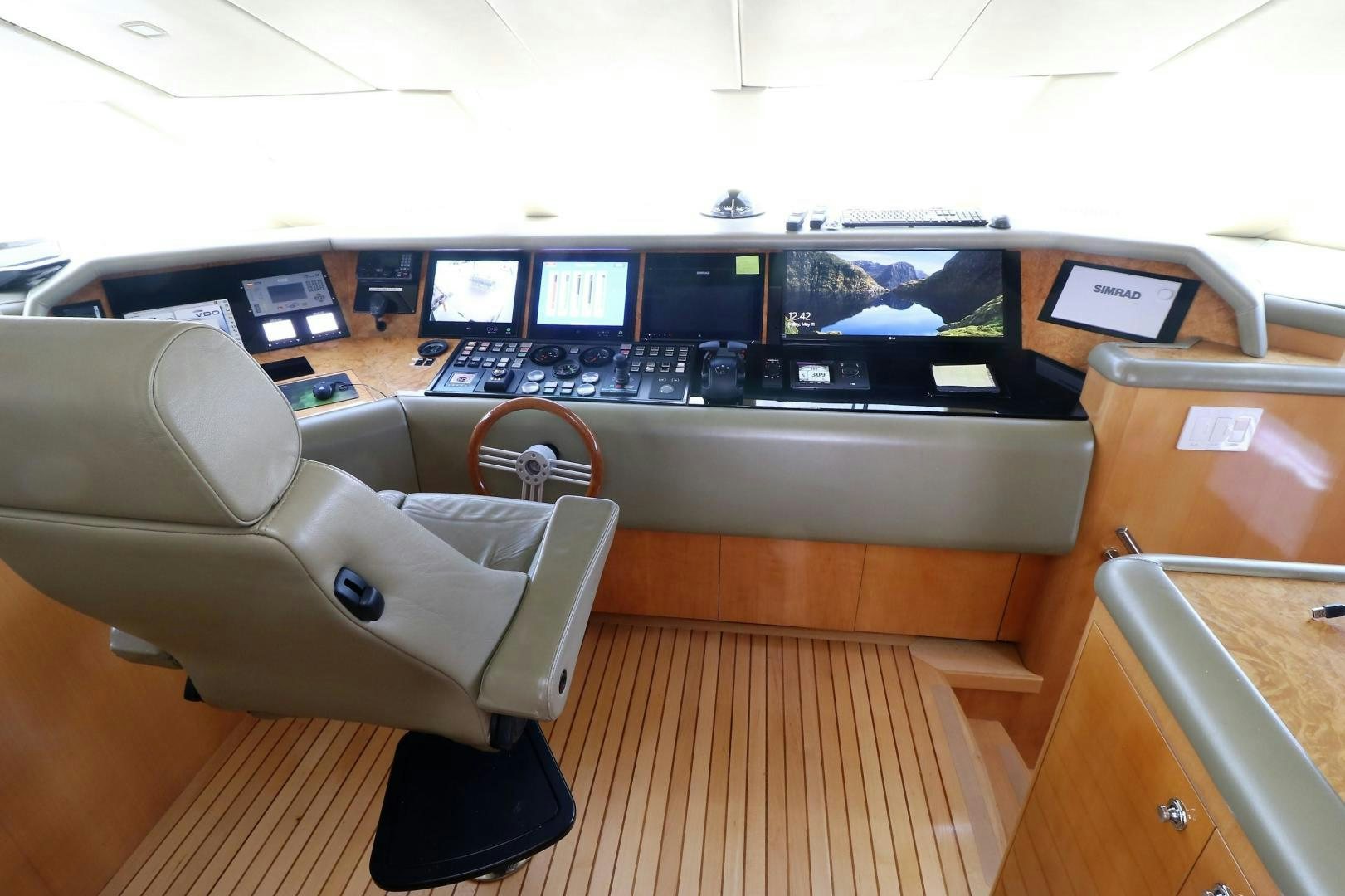 a room with a desk and a chair with a computer on it aboard No Name Yacht for Sale