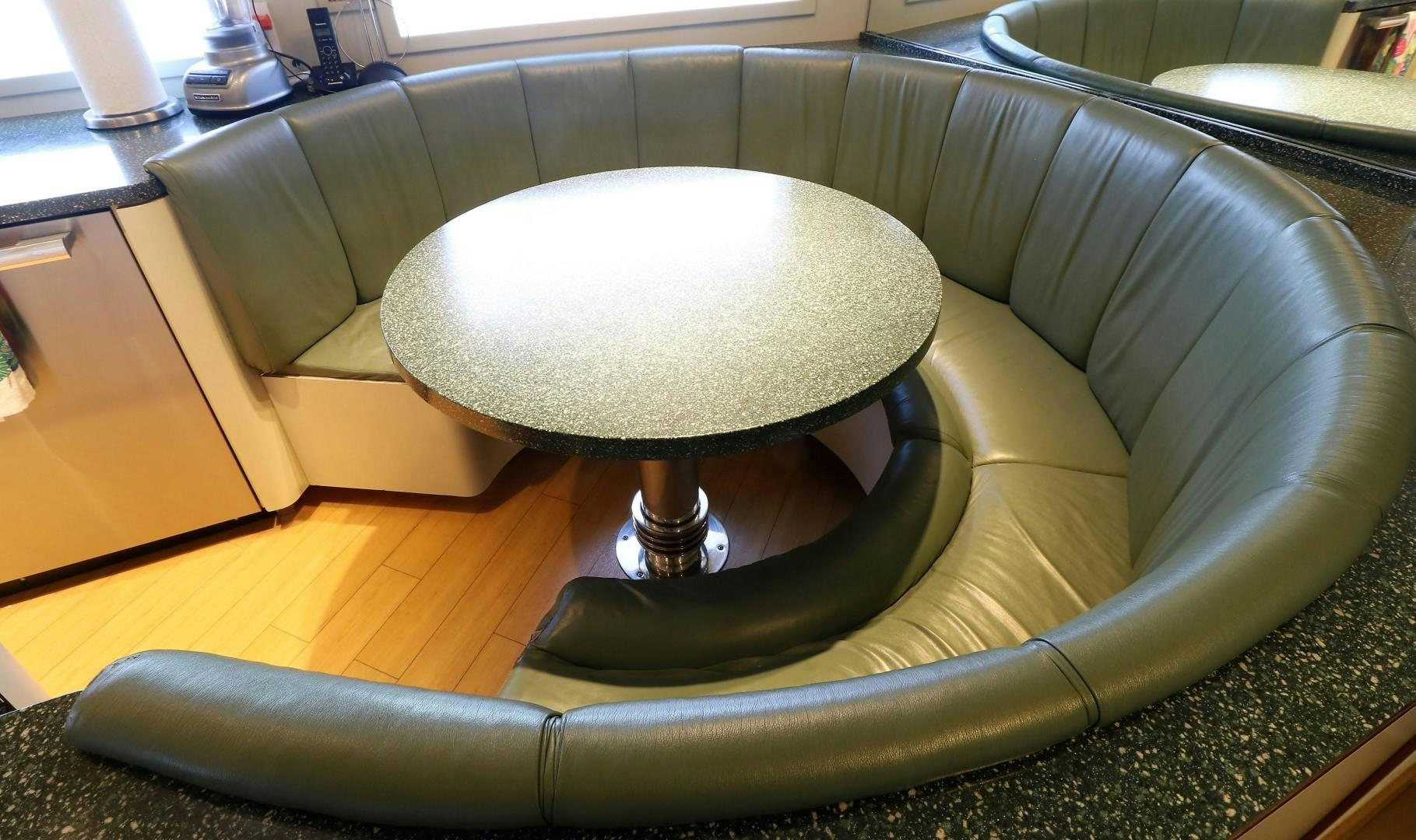 a couch in a room aboard No Name Yacht for Sale