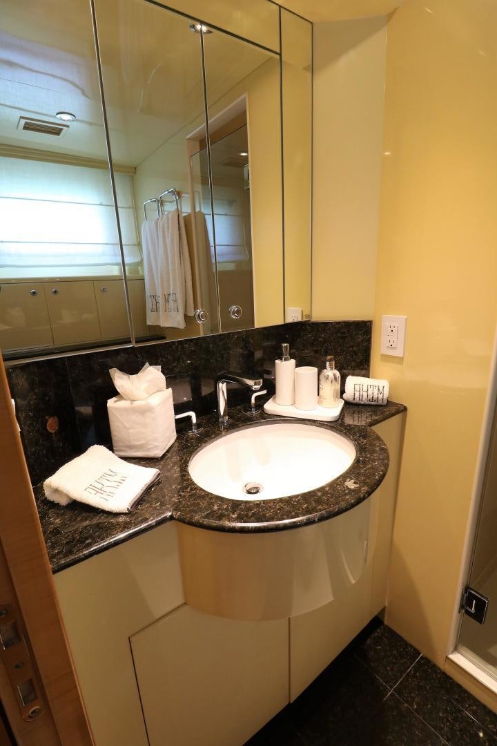 a bathroom with a sink and a mirror aboard No Name Yacht for Sale