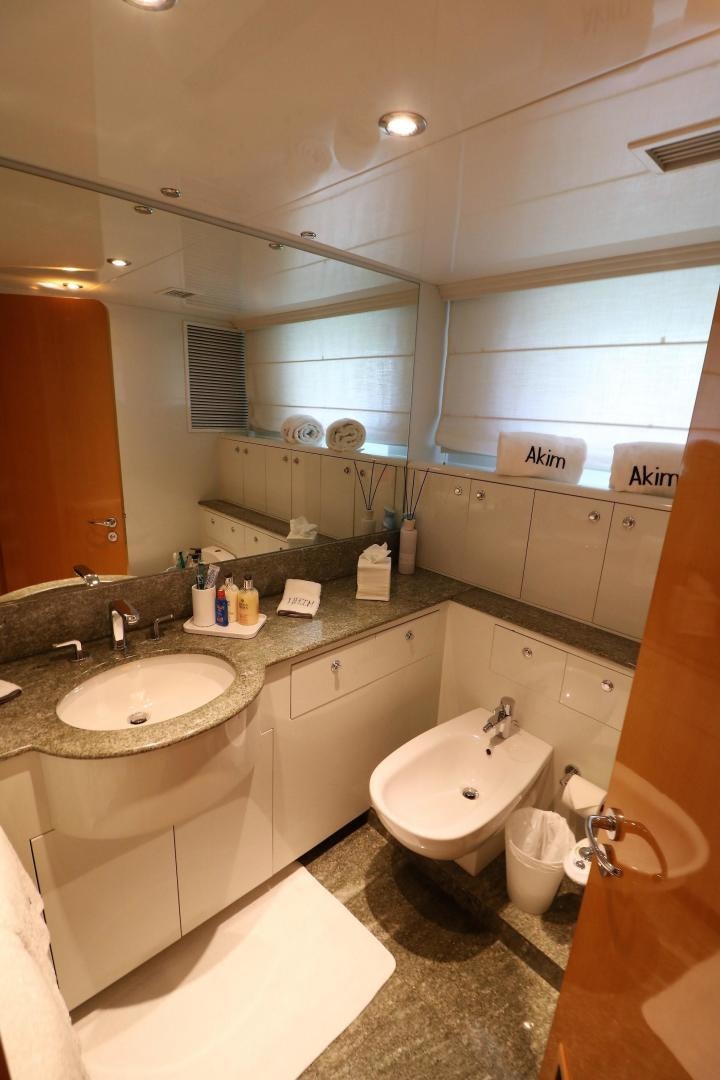 a bathroom with a sink and a mirror aboard No Name Yacht for Sale
