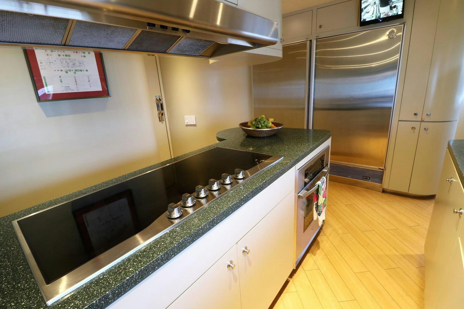 a kitchen with stainless steel appliances aboard No Name Yacht for Sale