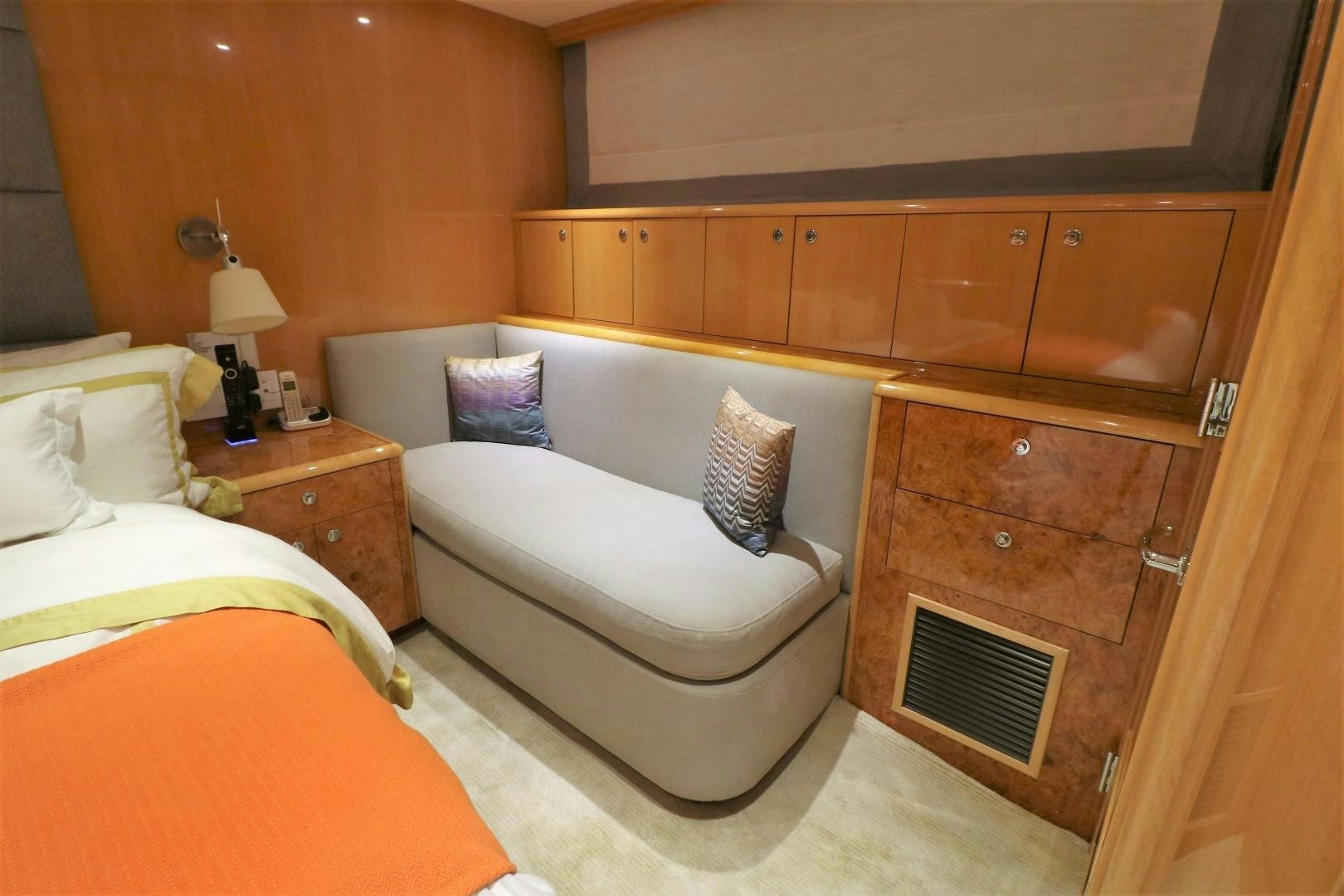 a room with a bed and a dresser aboard No Name Yacht for Sale