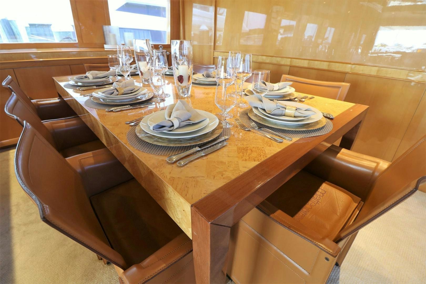 a table set with plates and silverware aboard No Name Yacht for Sale